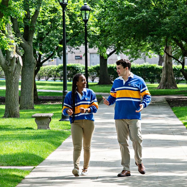 Students walking on sidewalk