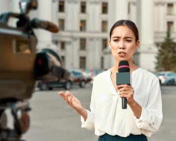 A reporter delivers a live report. 